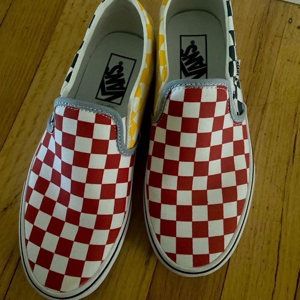 Vans slip on checker board skate shoes.